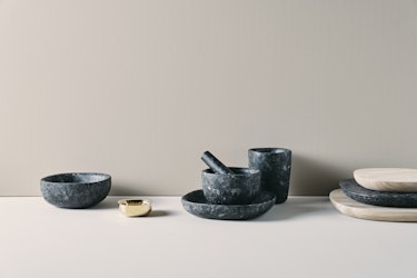 Bowl, tray and mortar in dark natural stone